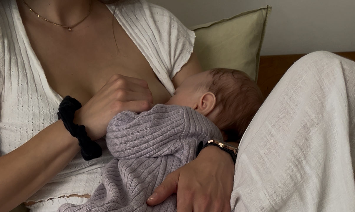 woman breastfeeding her baby